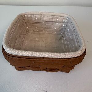 Longaberger basket with cream fabric liner and protector tray serving storage